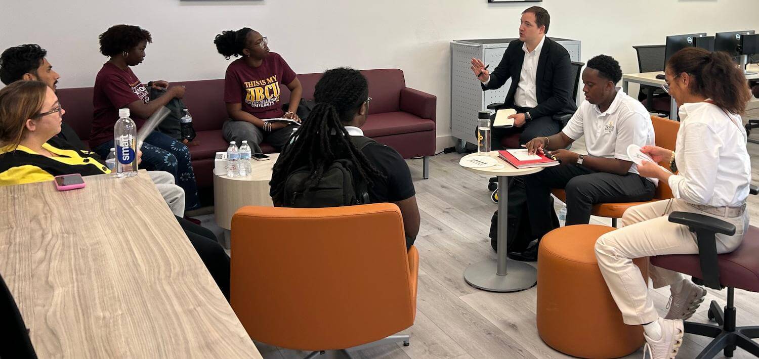 Dr. Andrew Mangle discussing with students